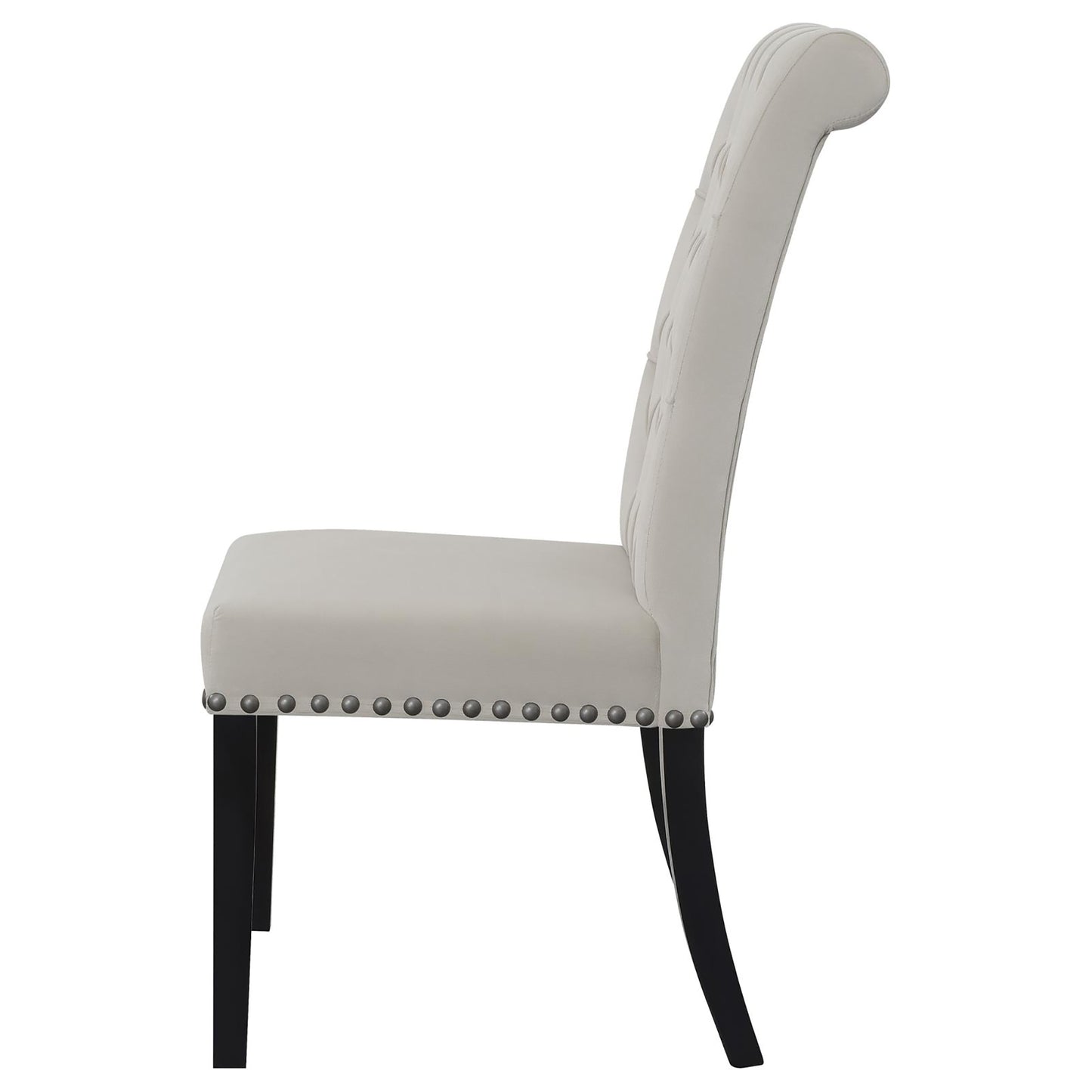 Tufted ivory velvet dining chair with nailhead trim and dark wood legs