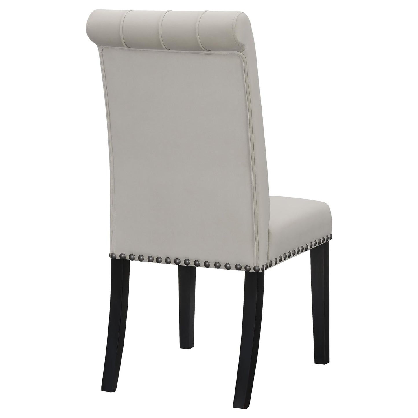 Light gray upholstered dining chair with tufted back and silver nailhead trim