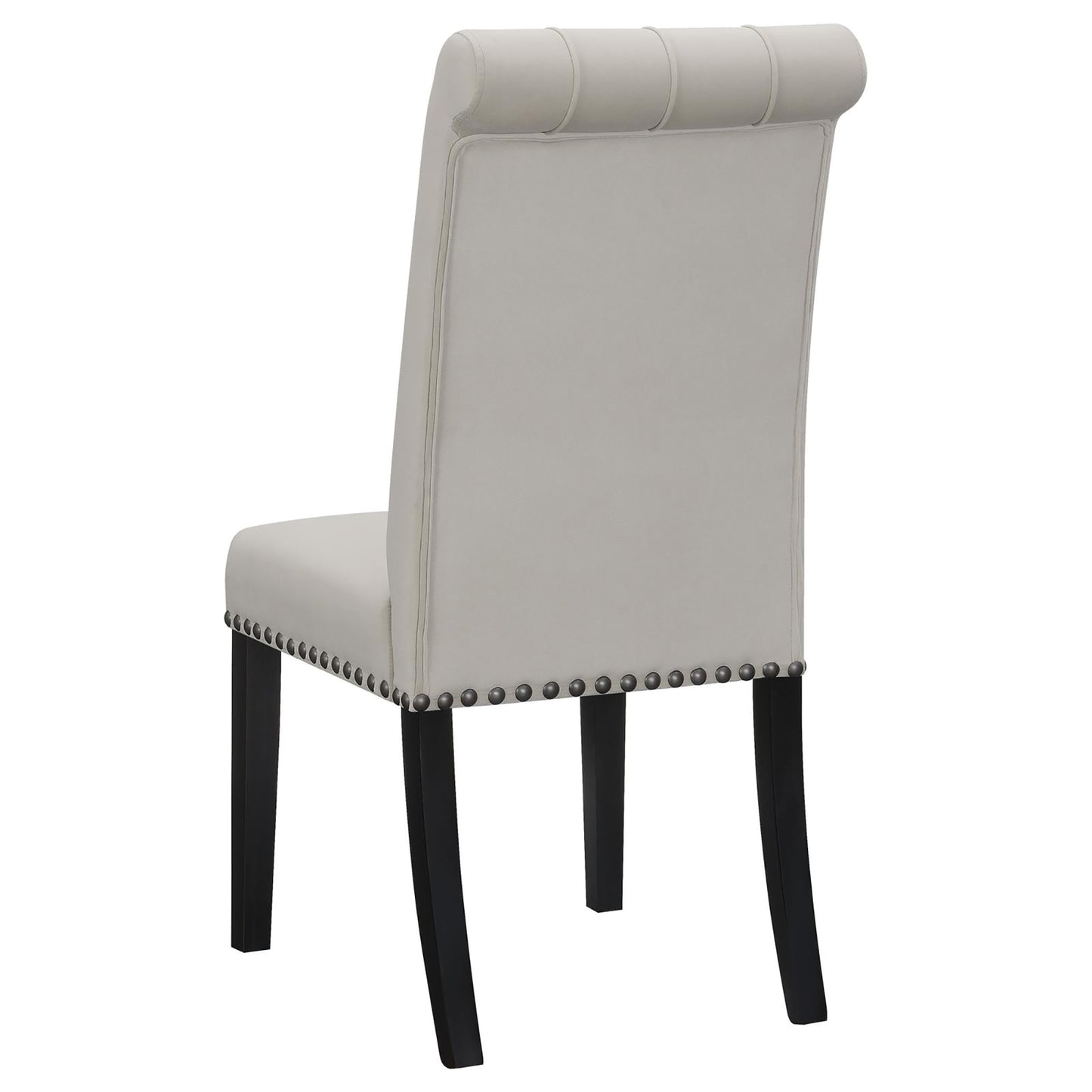 Light gray upholstered dining chair with tufted back and silver nailhead trim