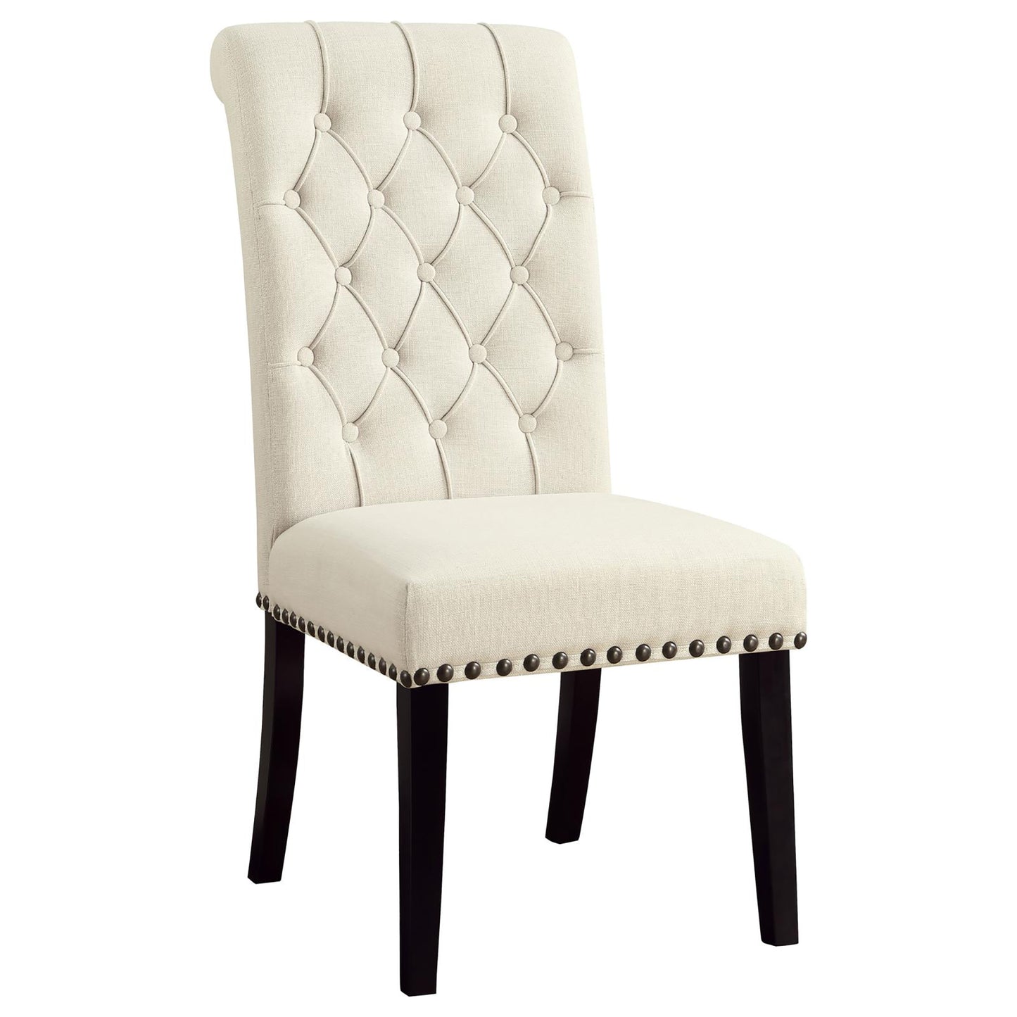 Tufted cream fabric dining chair with dark wood legs and antique brass nailhead trim