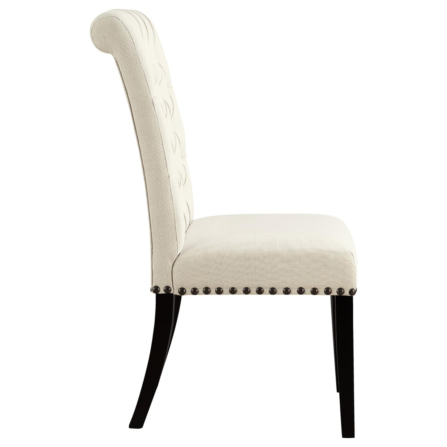 Elegant cream tufted dining chair with dark wood legs and nailhead trim