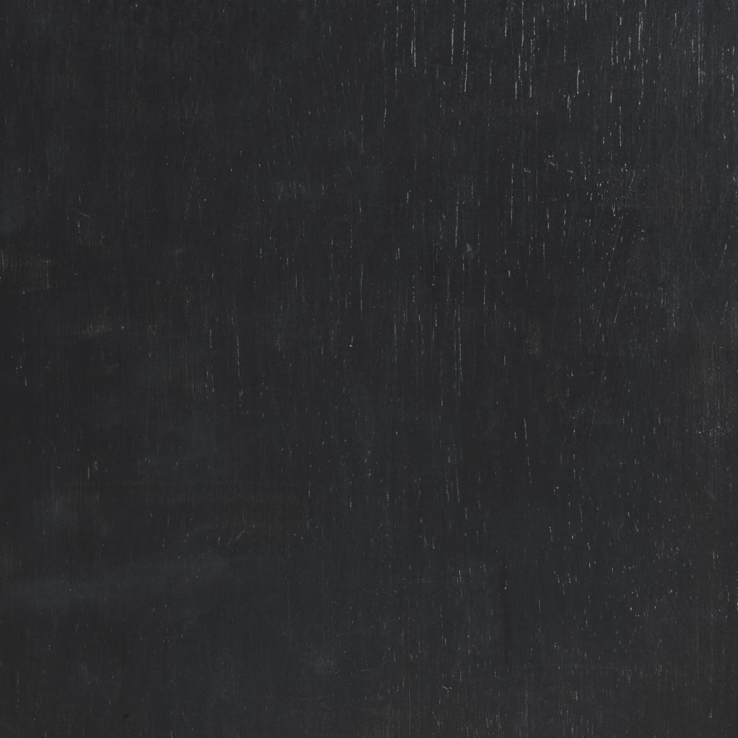 Dark gray textured surface with faint vertical scratches and subtle sheen