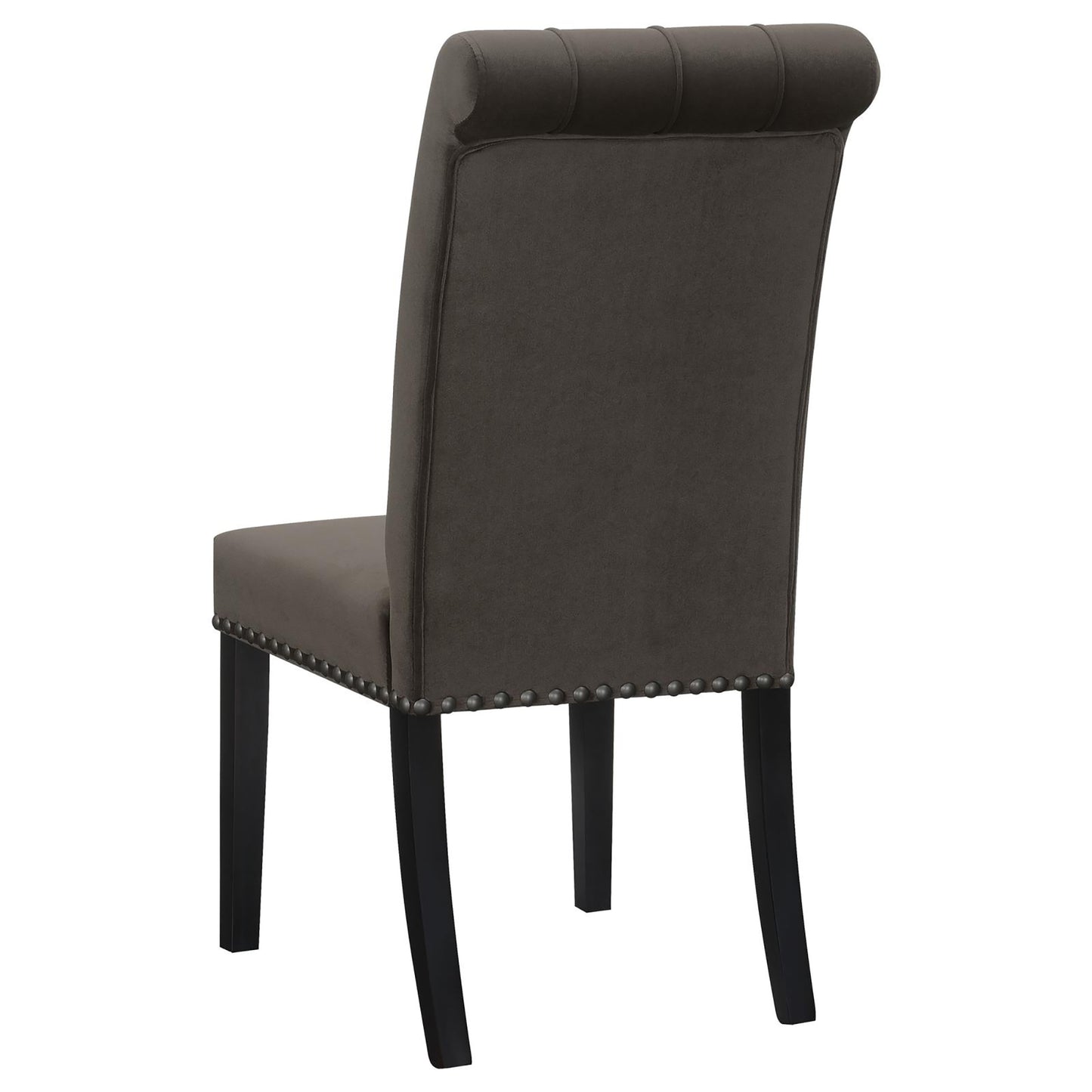 Dark gray velvet dining chair with tufted back and silver nailhead trim