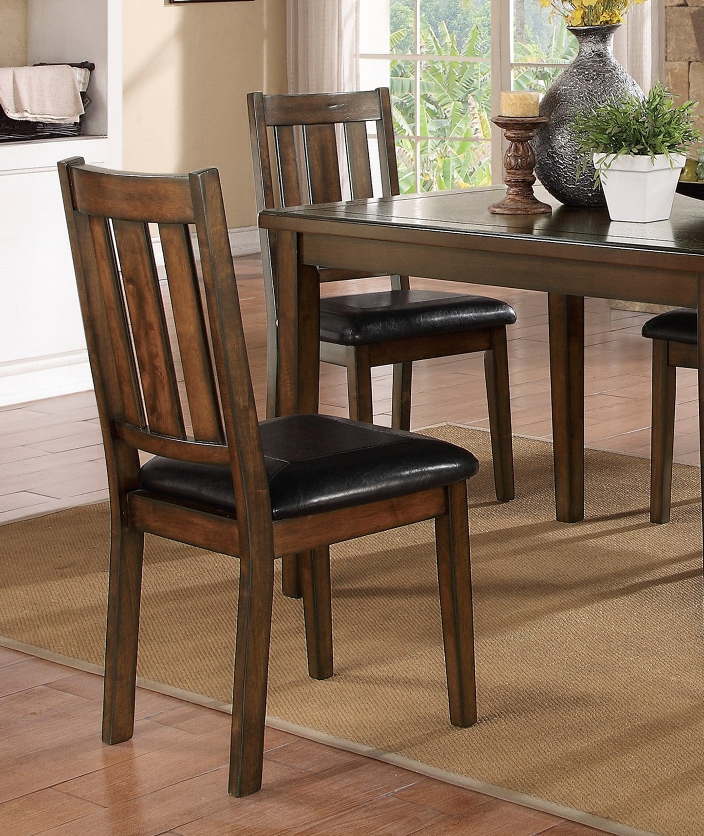 Rustic brown wooden dining chair with black faux leather seat