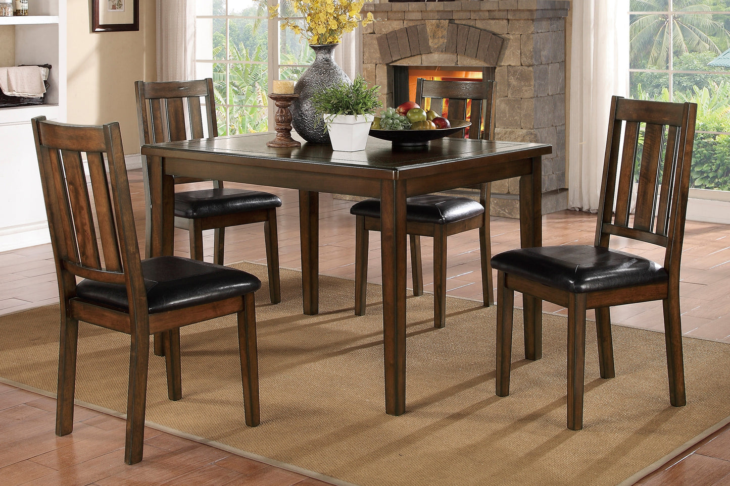 Dark wood dining table set with four upholstered chairs for a cozy dining room