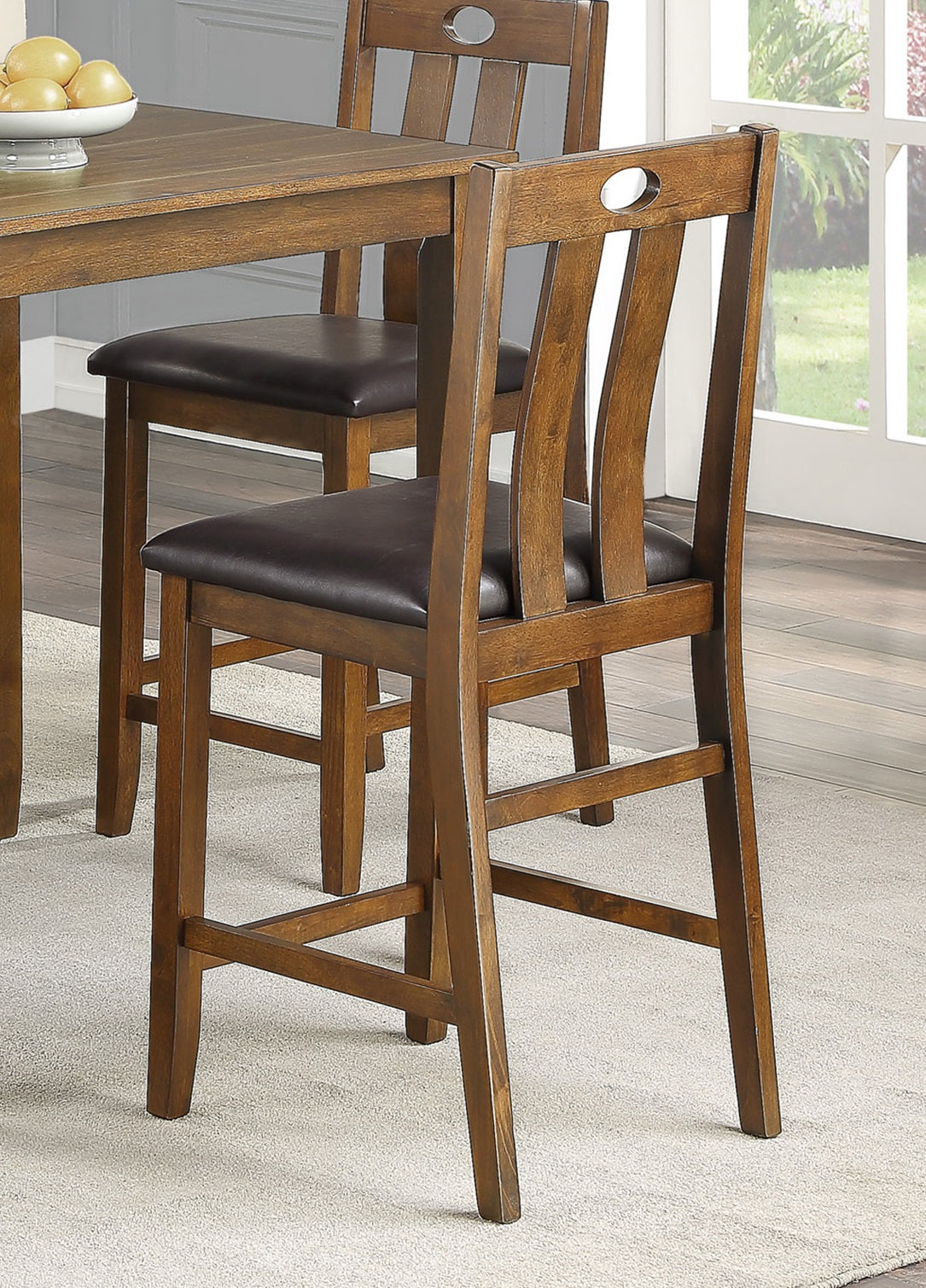 Wooden counter stool with dark brown faux leather seat and back cutout