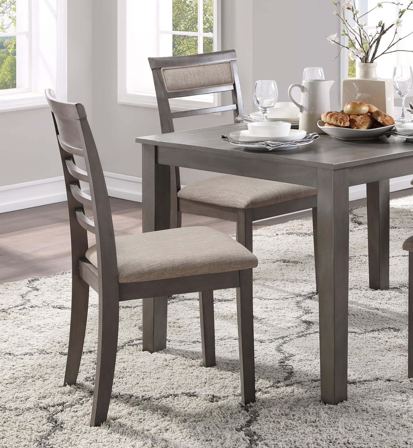 Gray wooden dining chair with upholstered seat and slatted back modern farmhouse style