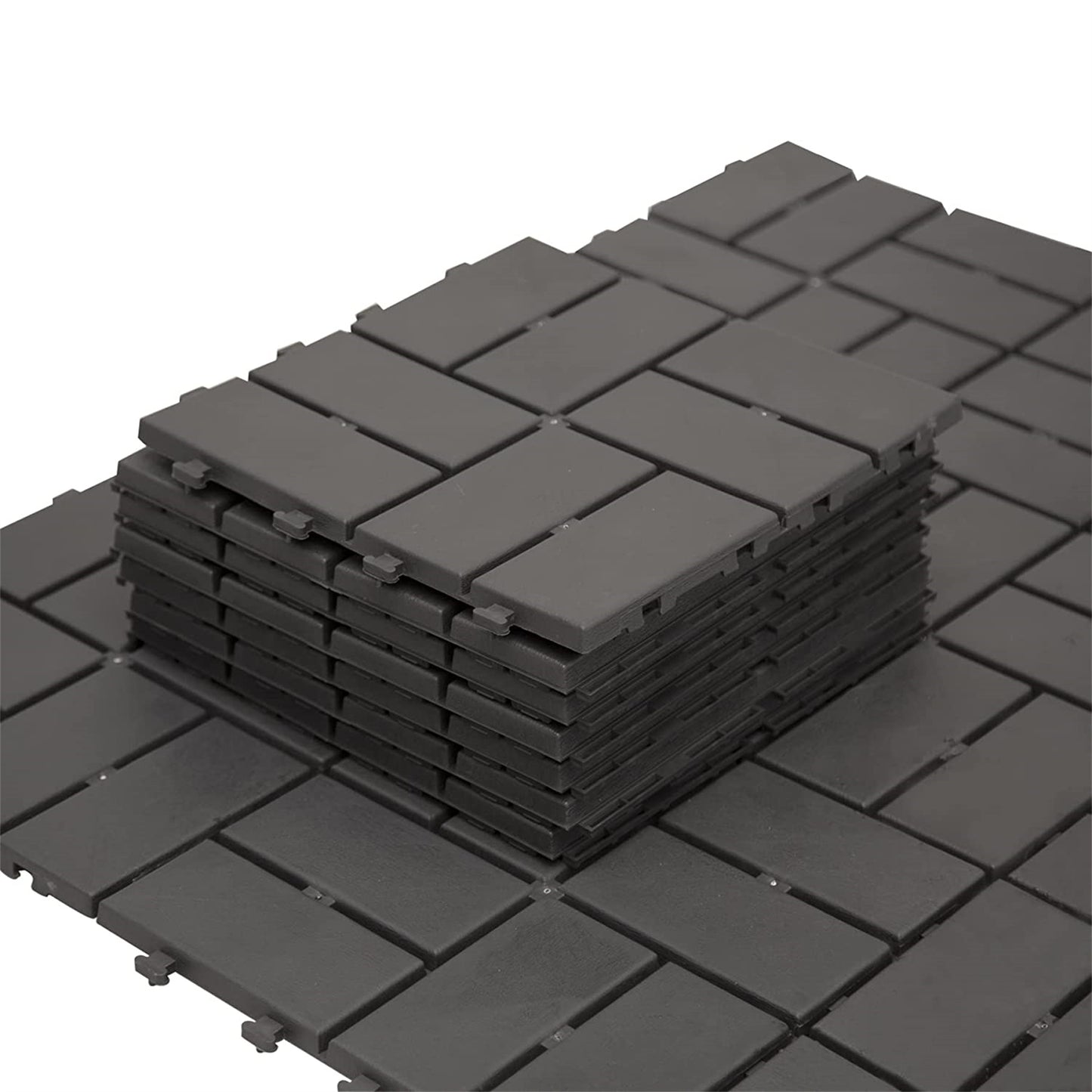 Stack of dark gray interlocking deck tiles ideal for patio flooring