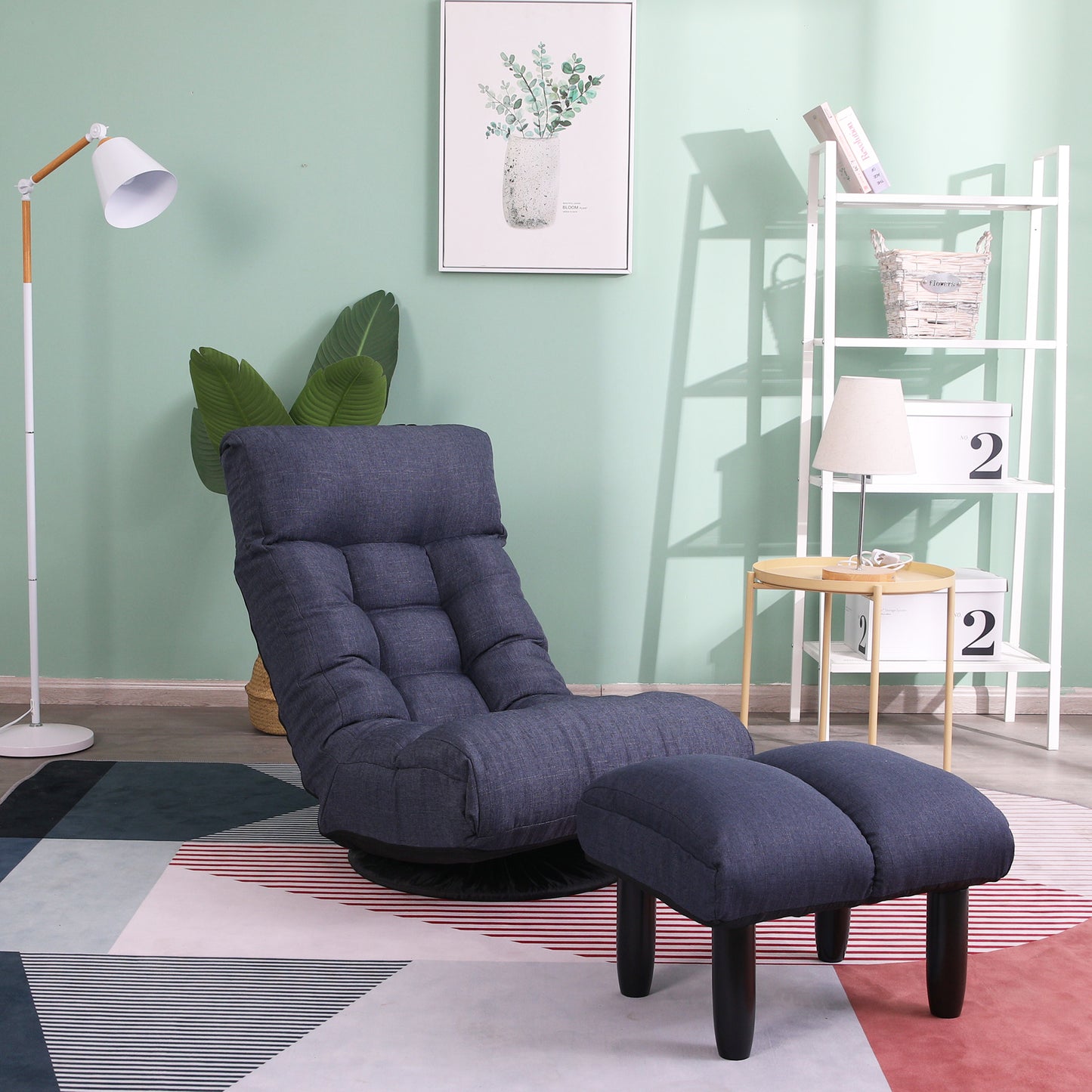 Dark blue tufted floor chair with matching ottoman perfect for a cozy reading nook