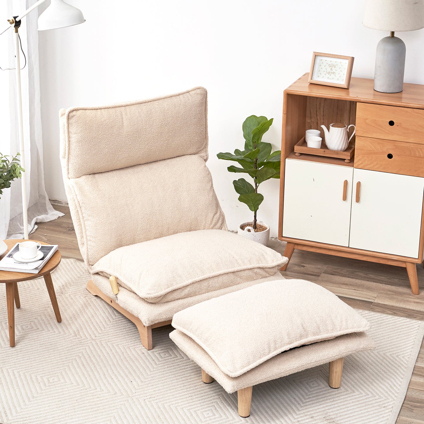 Cream boucle floor chair with adjustable backrest and matching ottoman for cozy relaxation