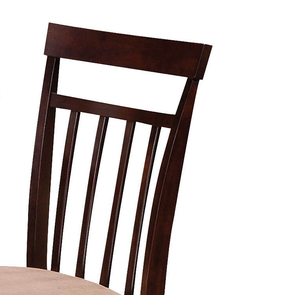 Dark wood dining chair with spindle backrest and upholstered seat