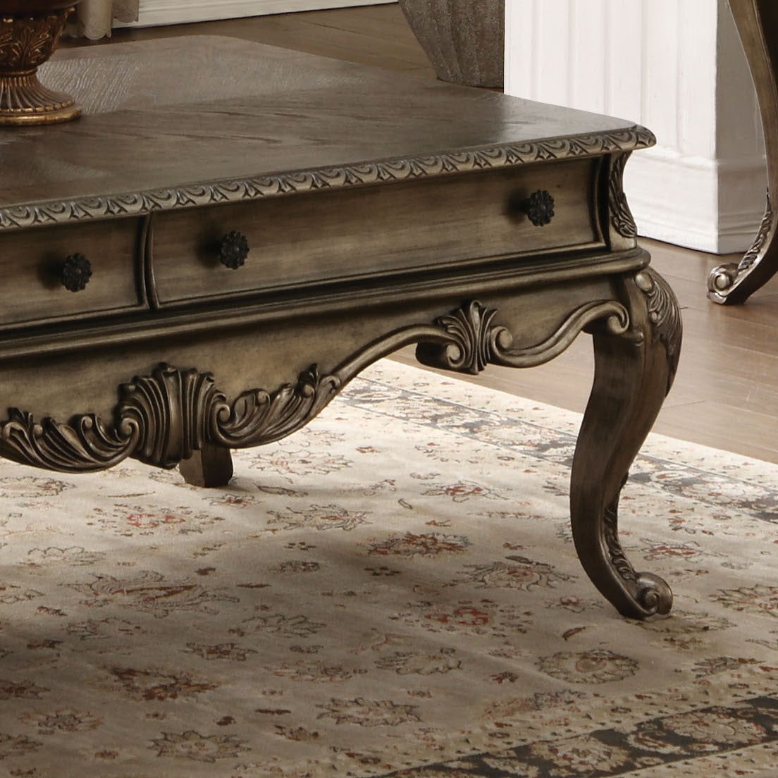 Antique carved wood coffee table with ornate legs and two drawers