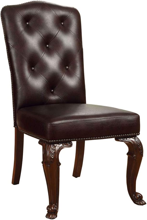 Tufted dark brown leather dining chair with ornate carved wooden legs