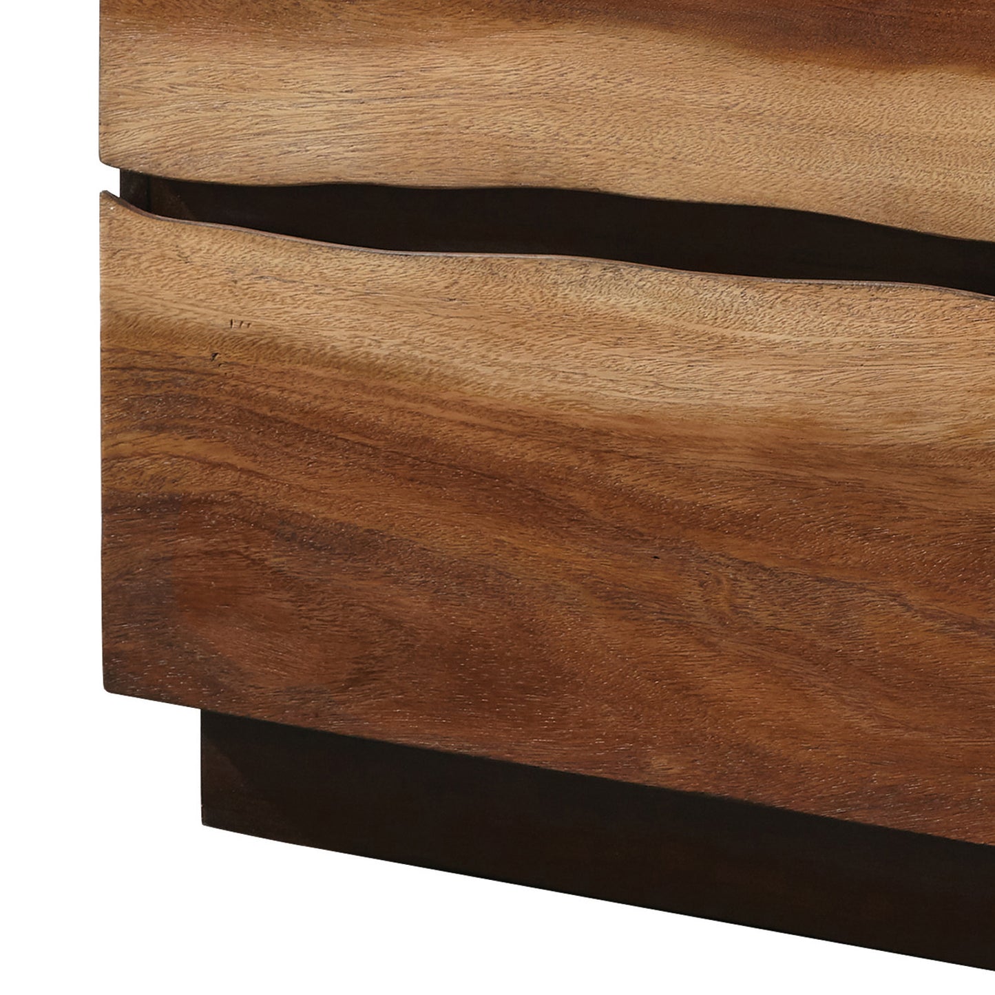 Closeup of a carved acacia wood table with natural grain details and a flowing edge design