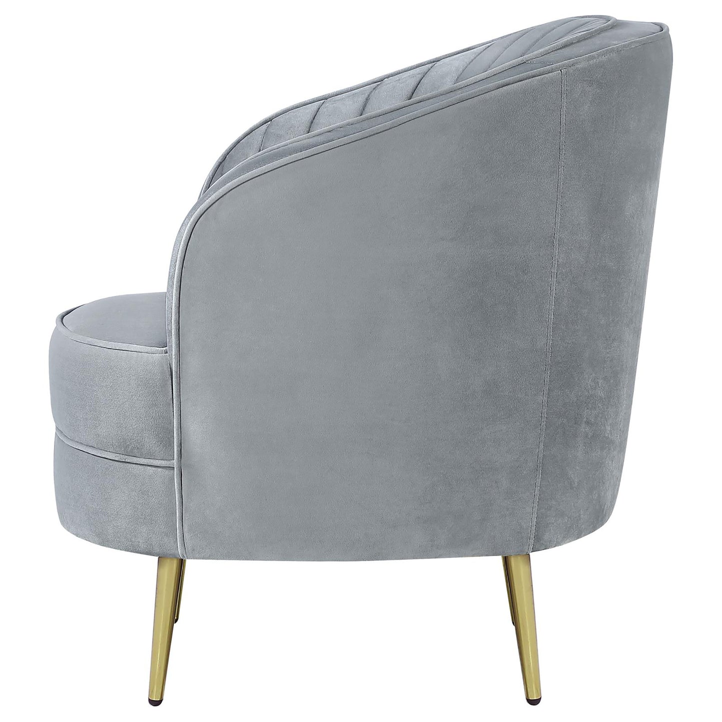 Gray velvet armchair with gold legs featuring channel tufting on the backrest for elegant accent seating