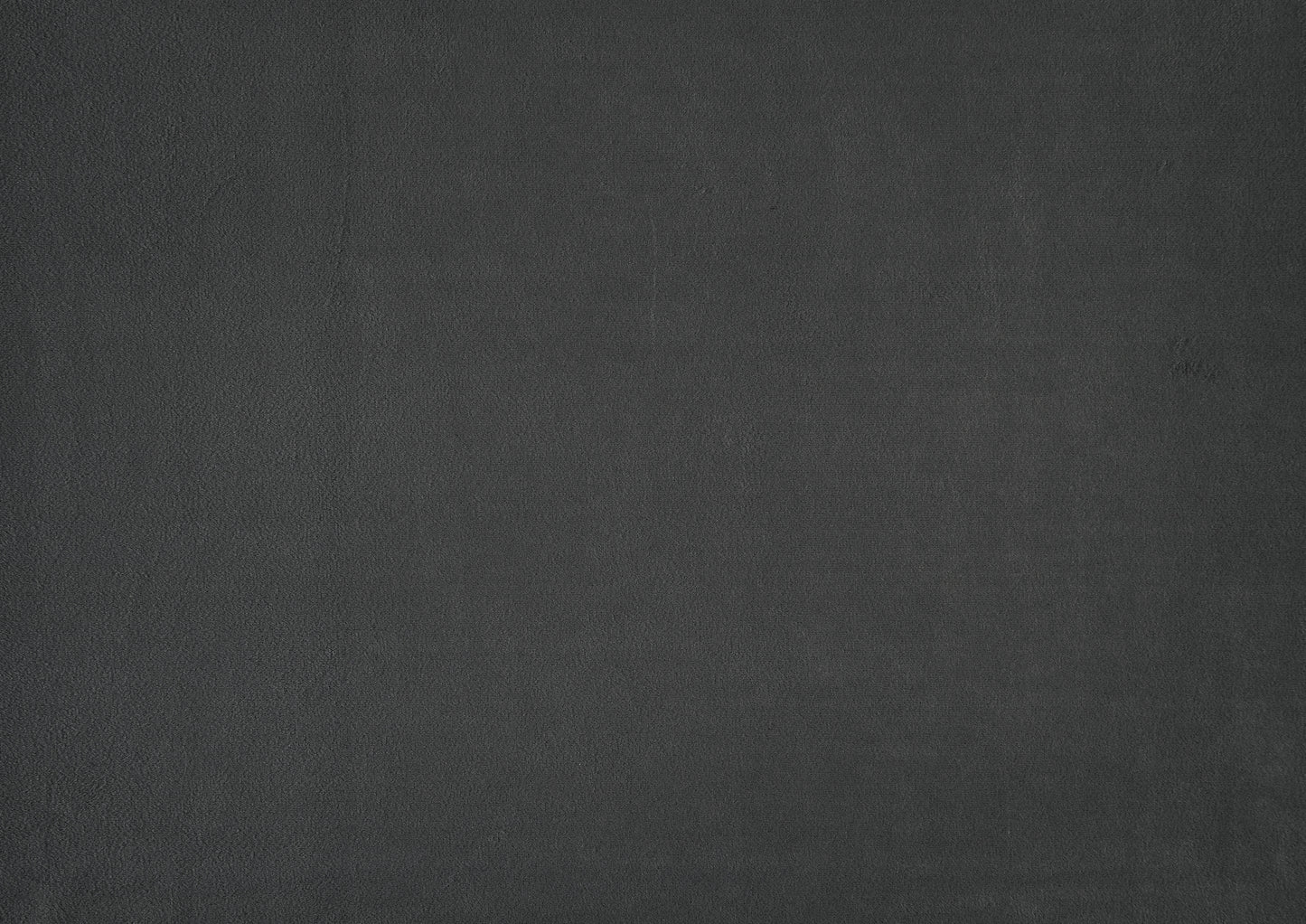 Dark charcoal grey textured background fabric for upholstery projects