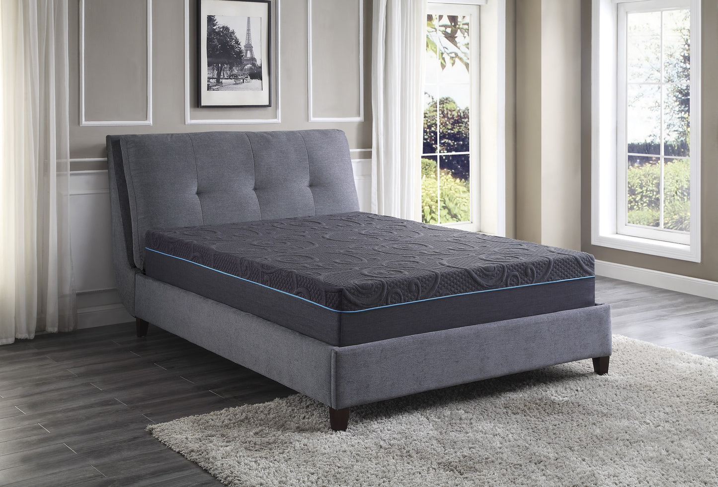 Charcoal grey hybrid mattress with detailed quilted pattern and blue piping on a grey bed frame