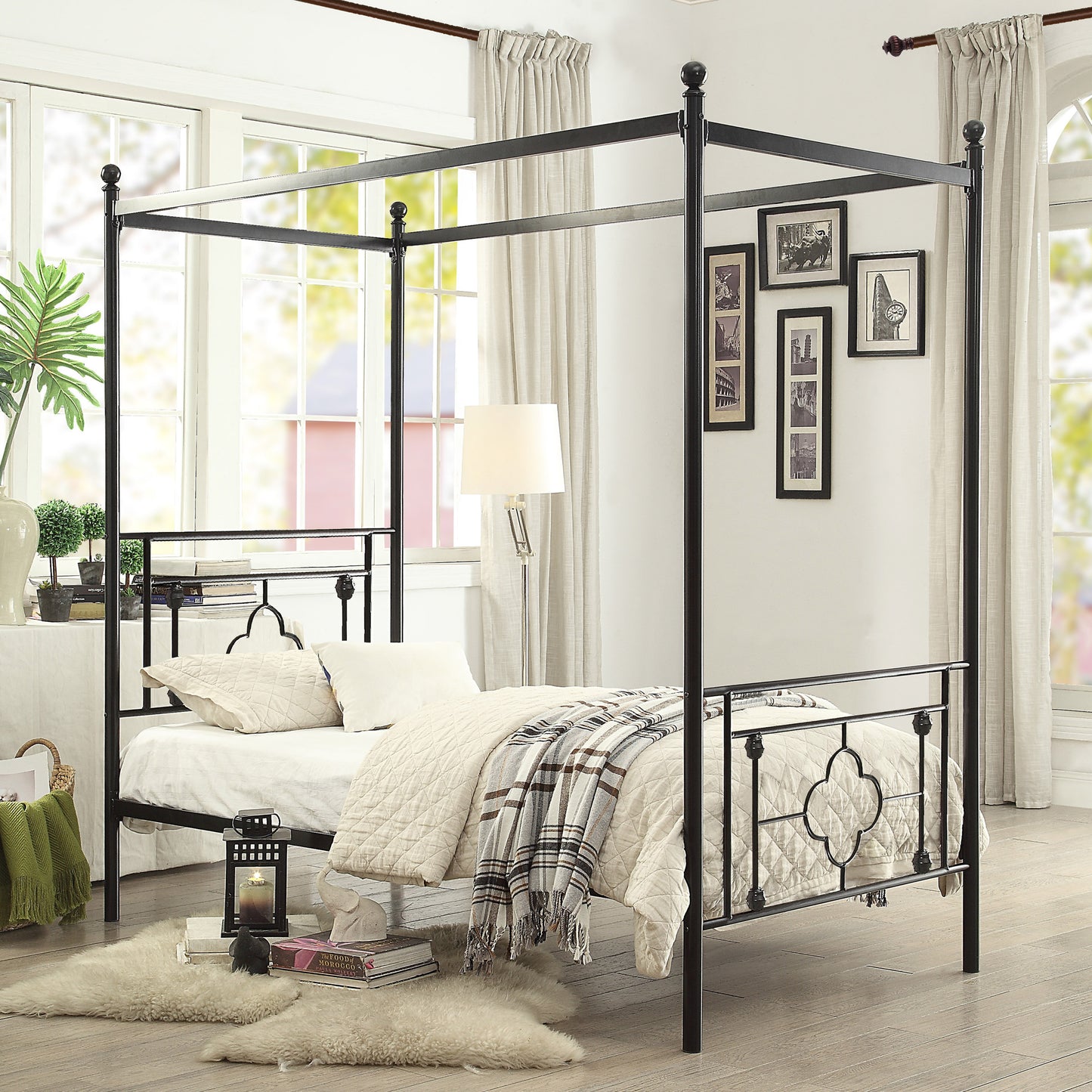 Black metal canopy bed with ornate headboard and footboard queen size