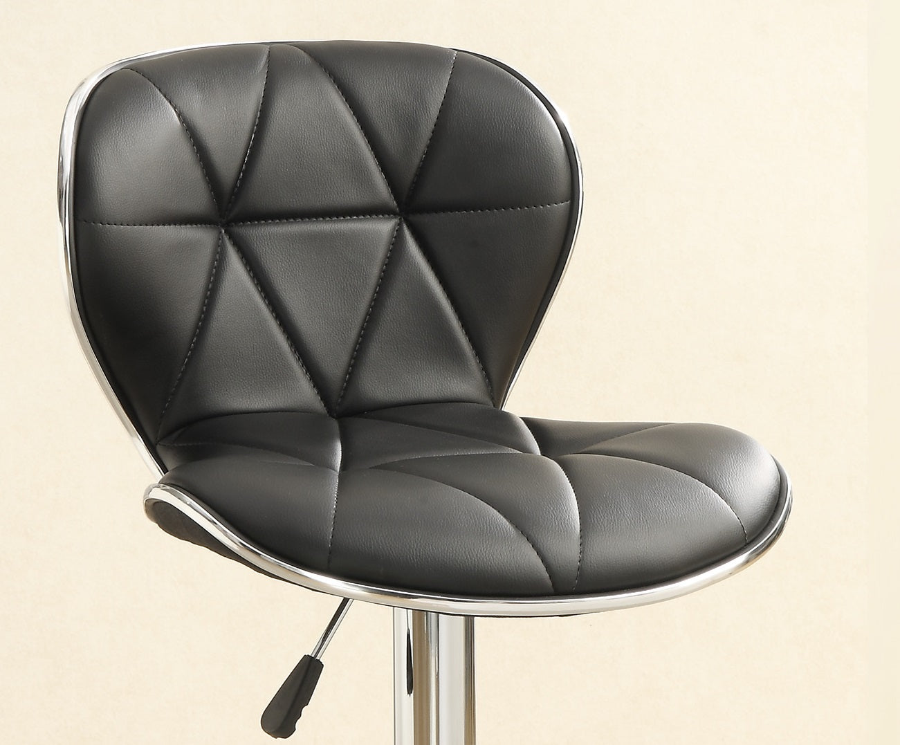 Black diamondstitched bar stool with chrome accents