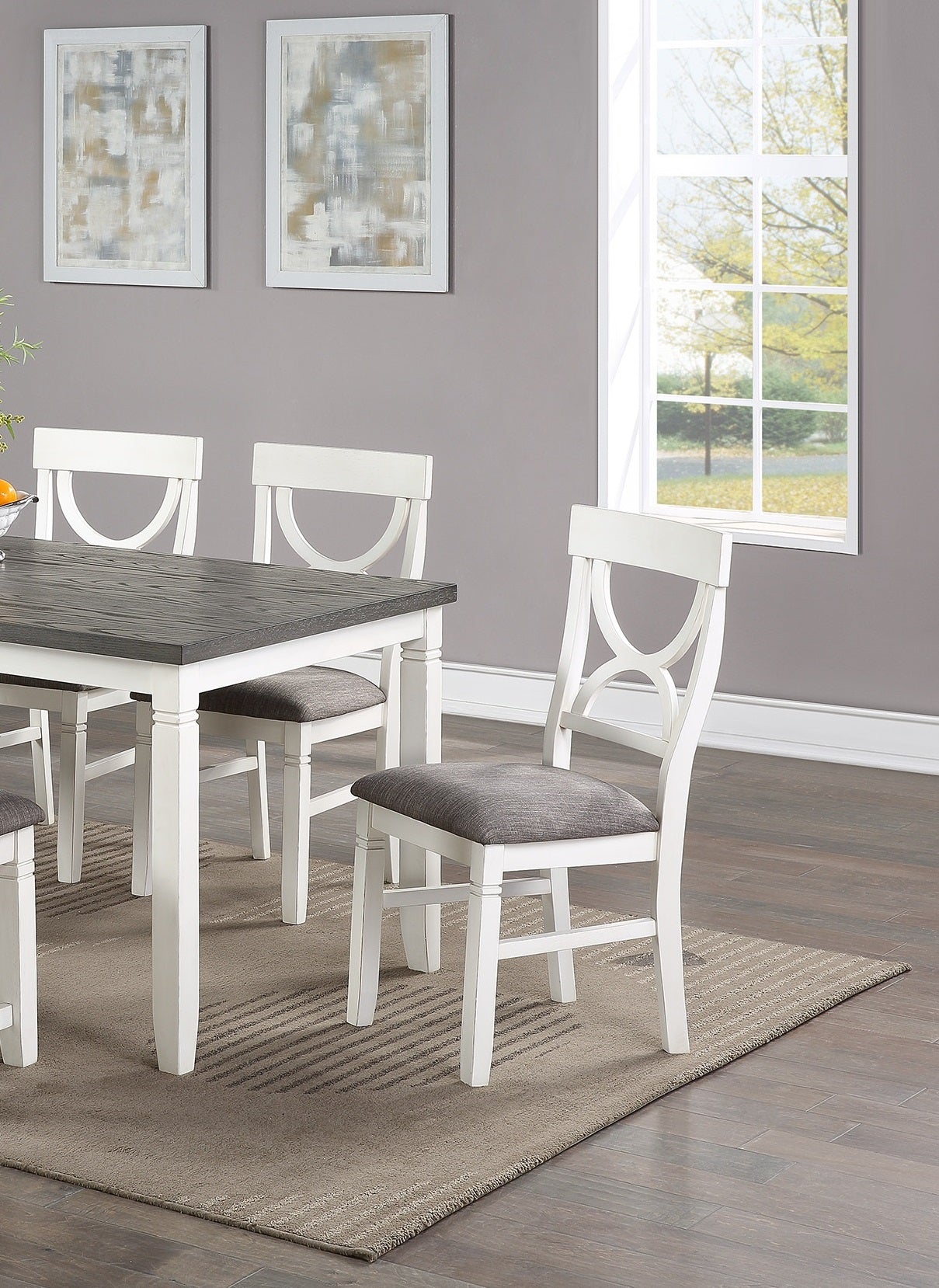 White dining chair with upholstered grey seat and decorative back detail