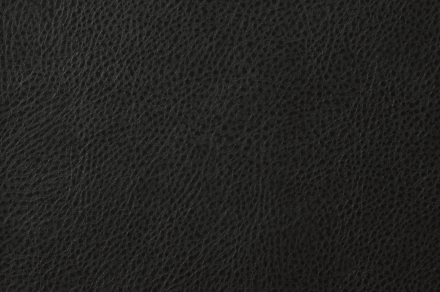 Closeup of a black leather texture with a subtle grain pattern perfect for upholstery or fashion