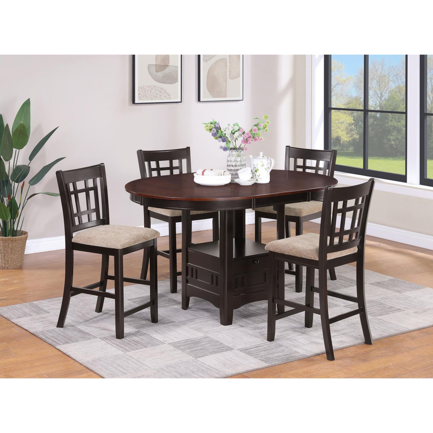 Dark wood oval dining table set with four counterheight chairs featuring beige upholstered seats and dark wood lattice backs