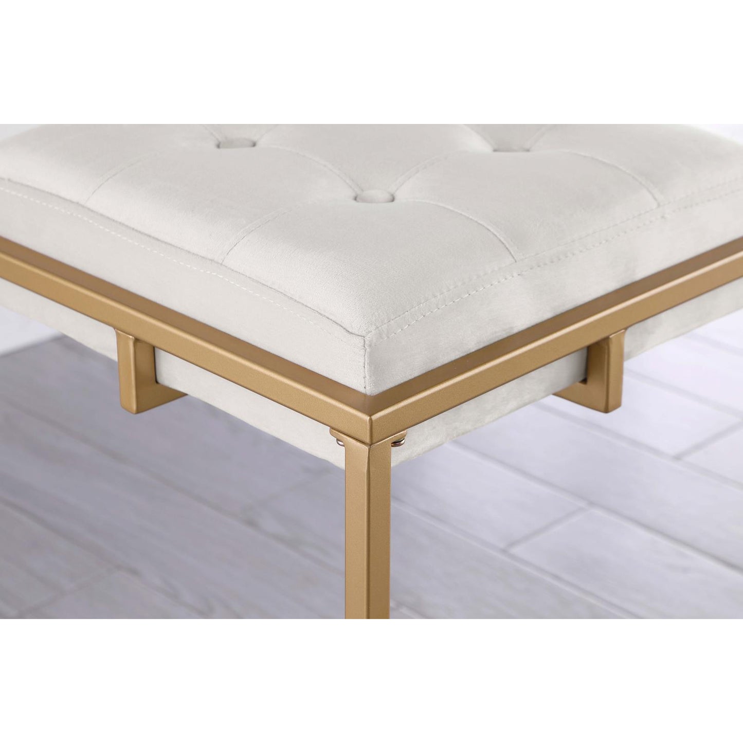 Tufted ivory velvet bench with modern gold metal legs characters