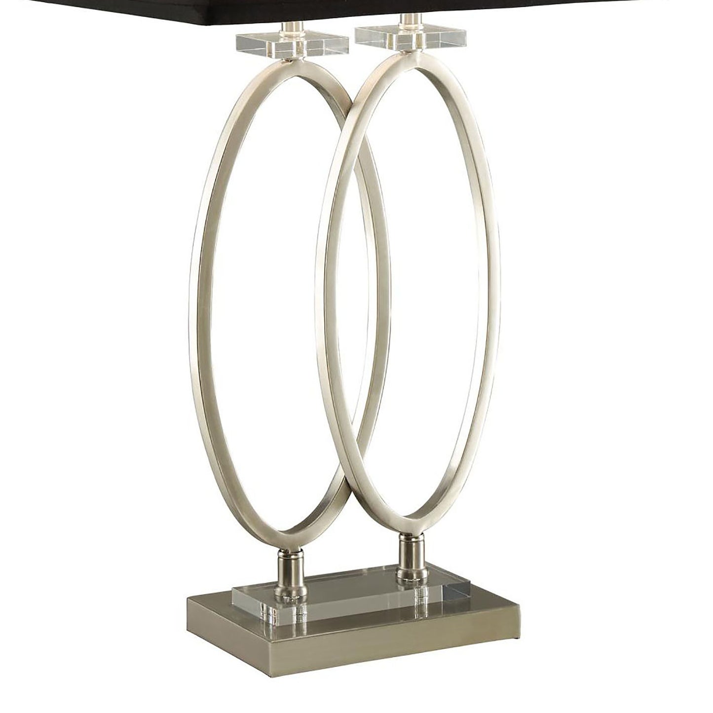 Modern silver lamp with interlocking oval design and clear acrylic accents