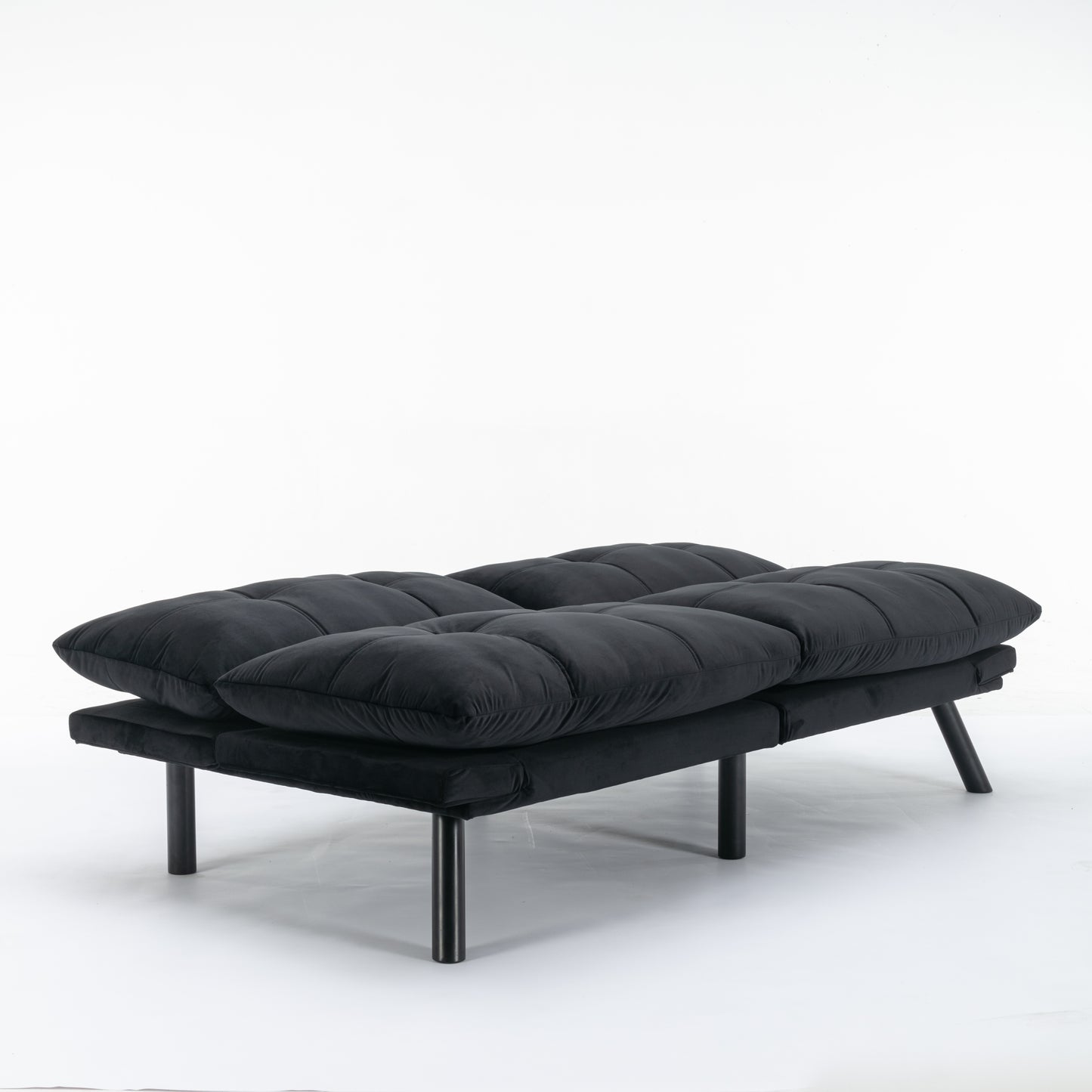 Plush black futon sofa with tufted cushions and sleek metal legs perfect for small apartments