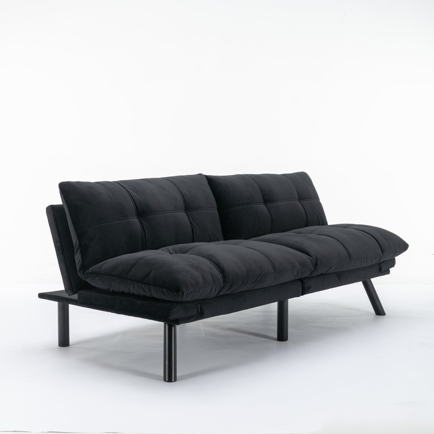 Black velvet convertible sofa with tufted cushions and dark metal legs