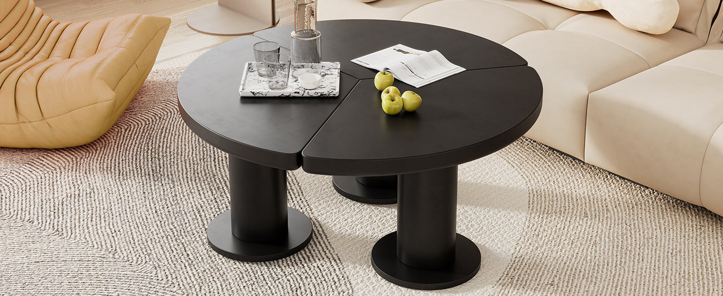 Modern black segmented coffee table with minimalist cylindrical legs on a textured rug