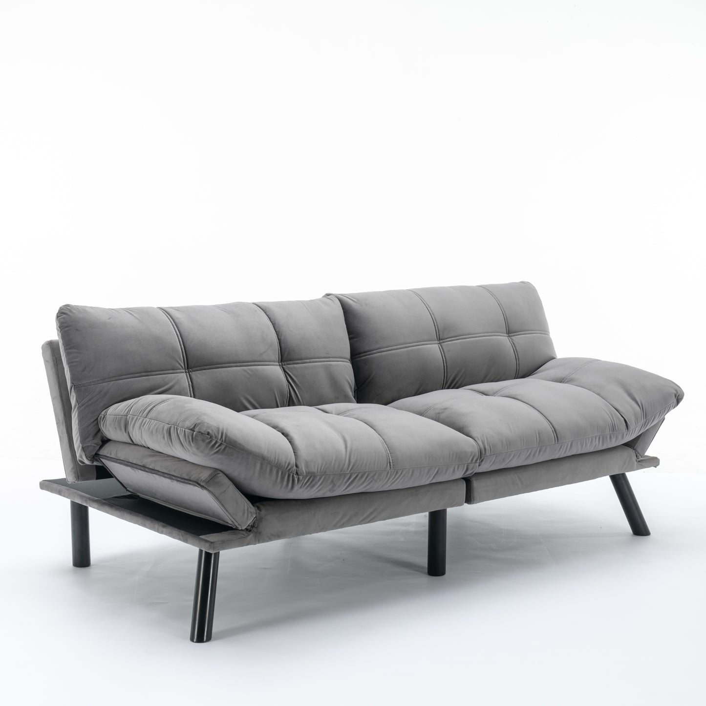 Grey fabric futon sofa with tufted cushions and modern black legs