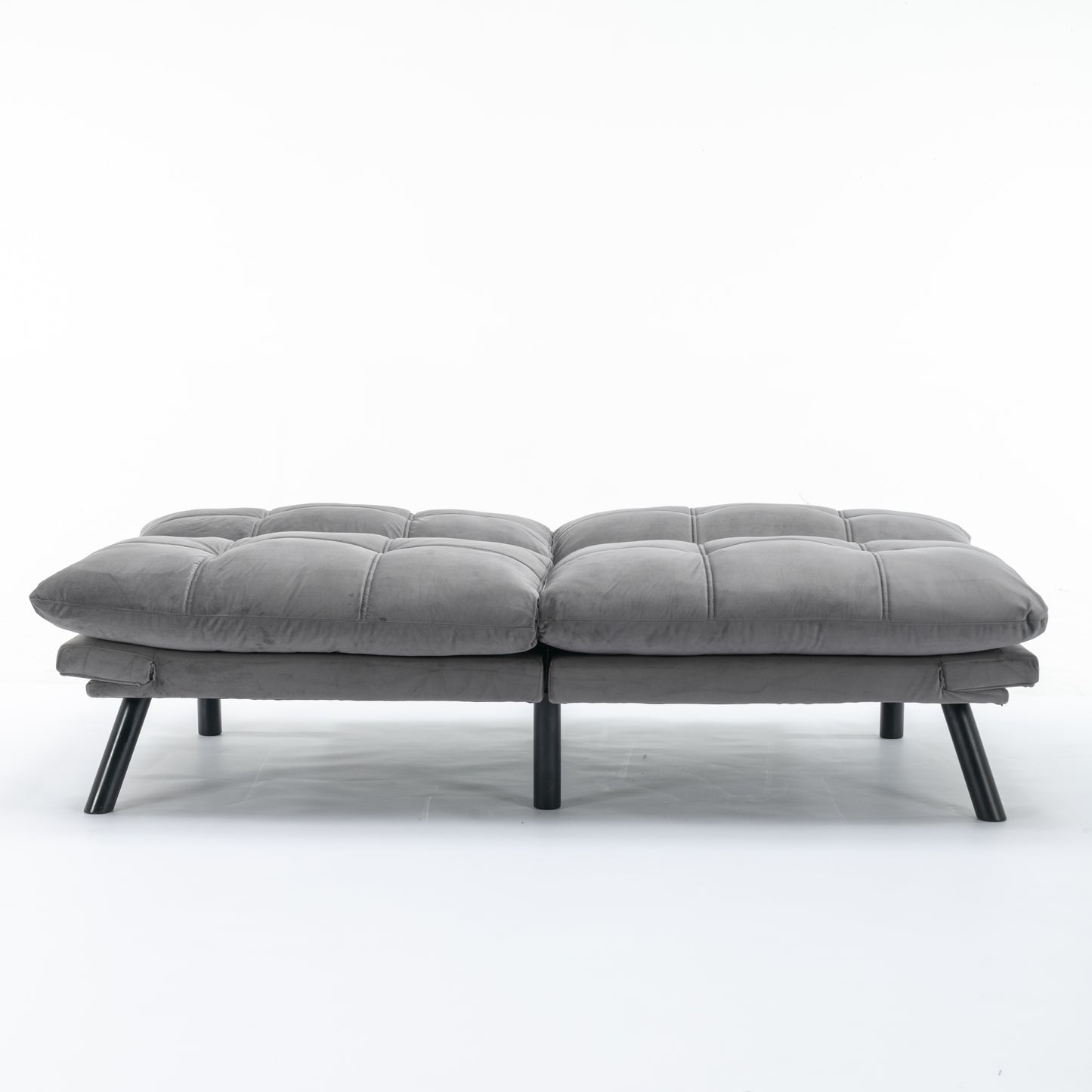 Tufted gray velvet futon with modern black legs perfect for small spaces