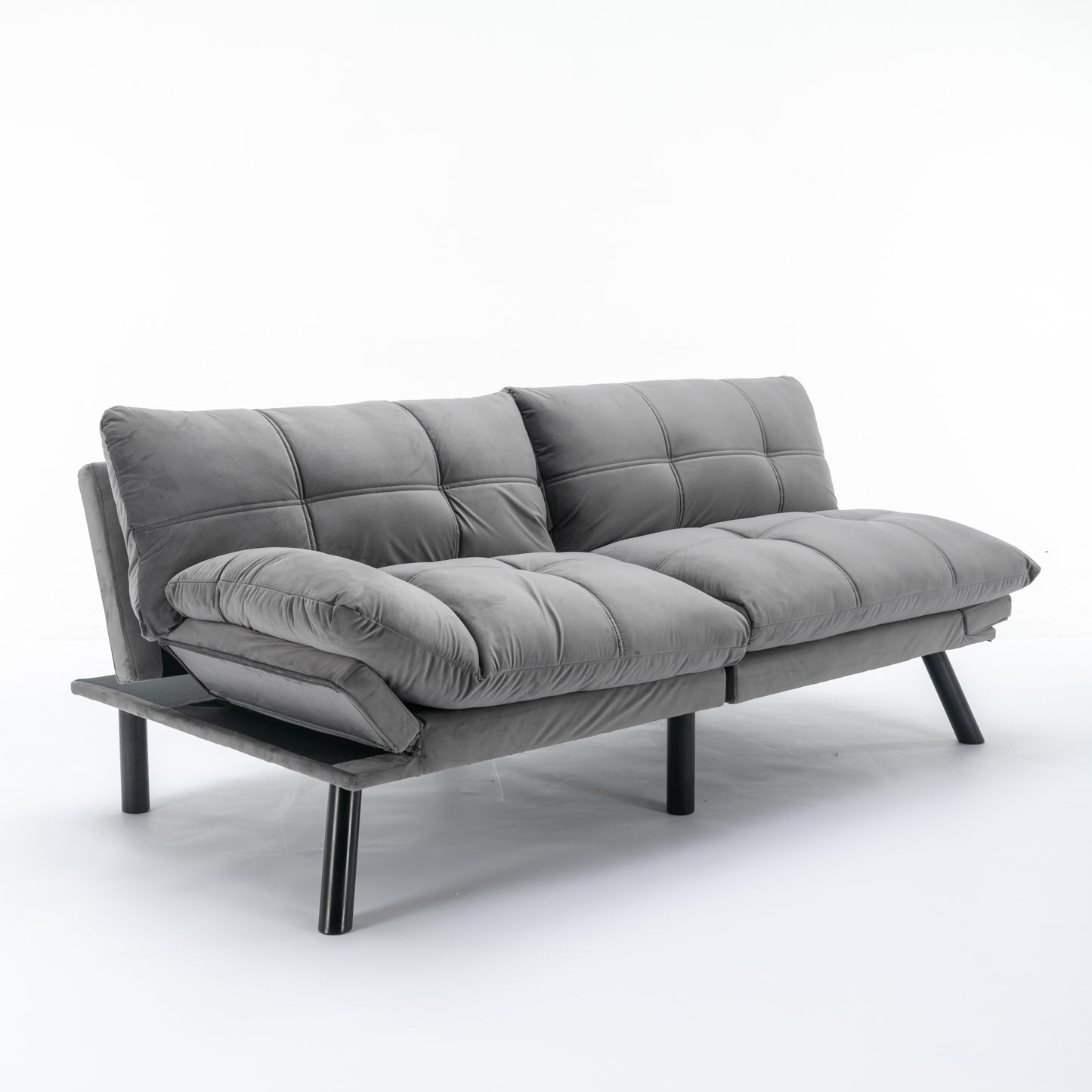 Grey velvet convertible sofa with tufted cushions and black metal legs