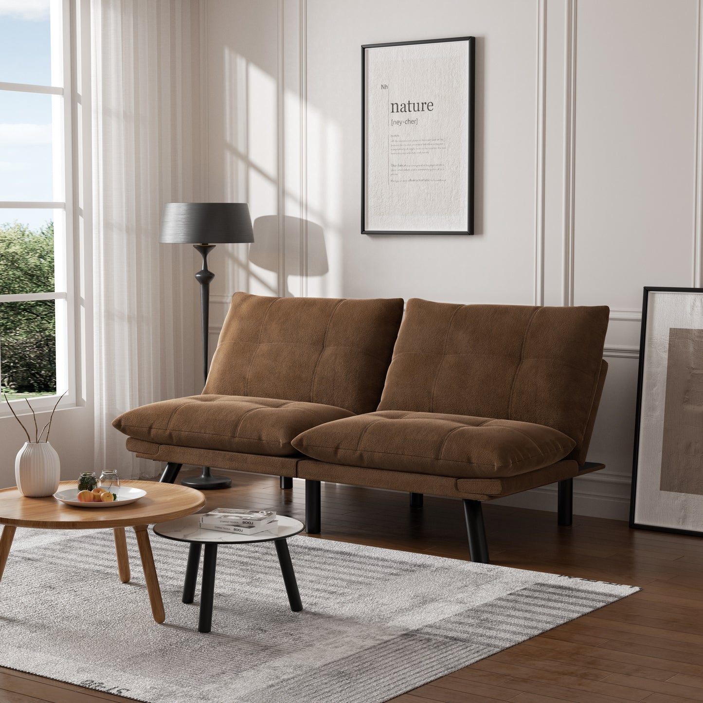Brown futon sofa with tufted cushions and black legs perfect for small spaces