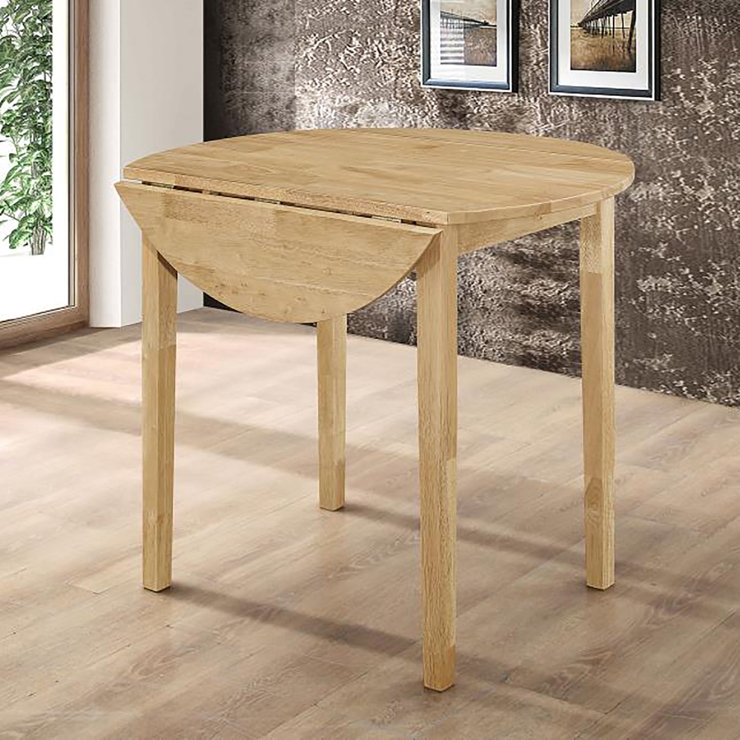 Round oak drop leaf dining table with natural finish perfect for small kitchens