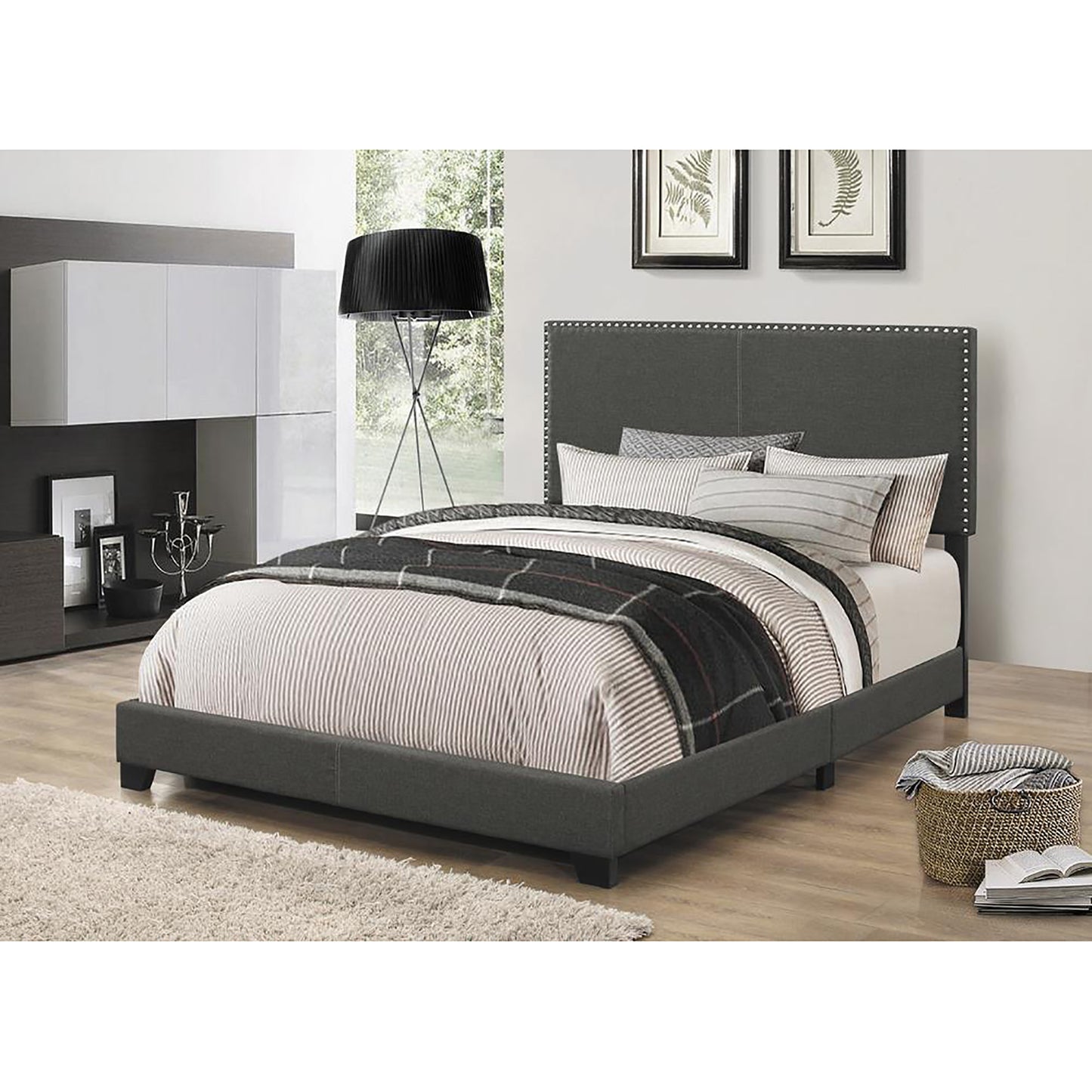 Charcoal fabric upholstered bed frame with a buttontufted headboard and sturdy wooden legs