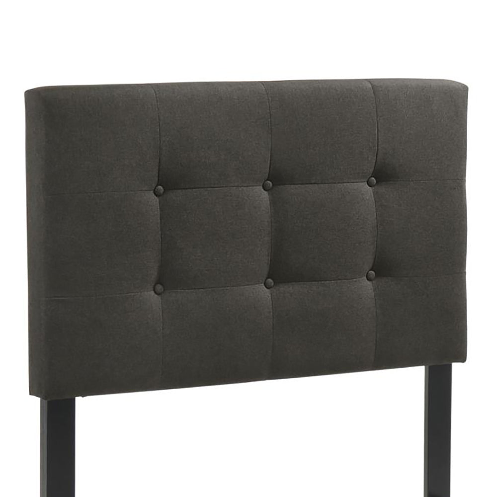 Charcoal gray fabric headboard with tufted design and black metal legs