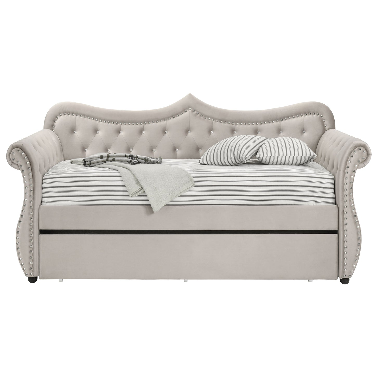Elegant grey velvet daybed with tufted back and rhinestone accents featuring a pullout trundle bed for guests