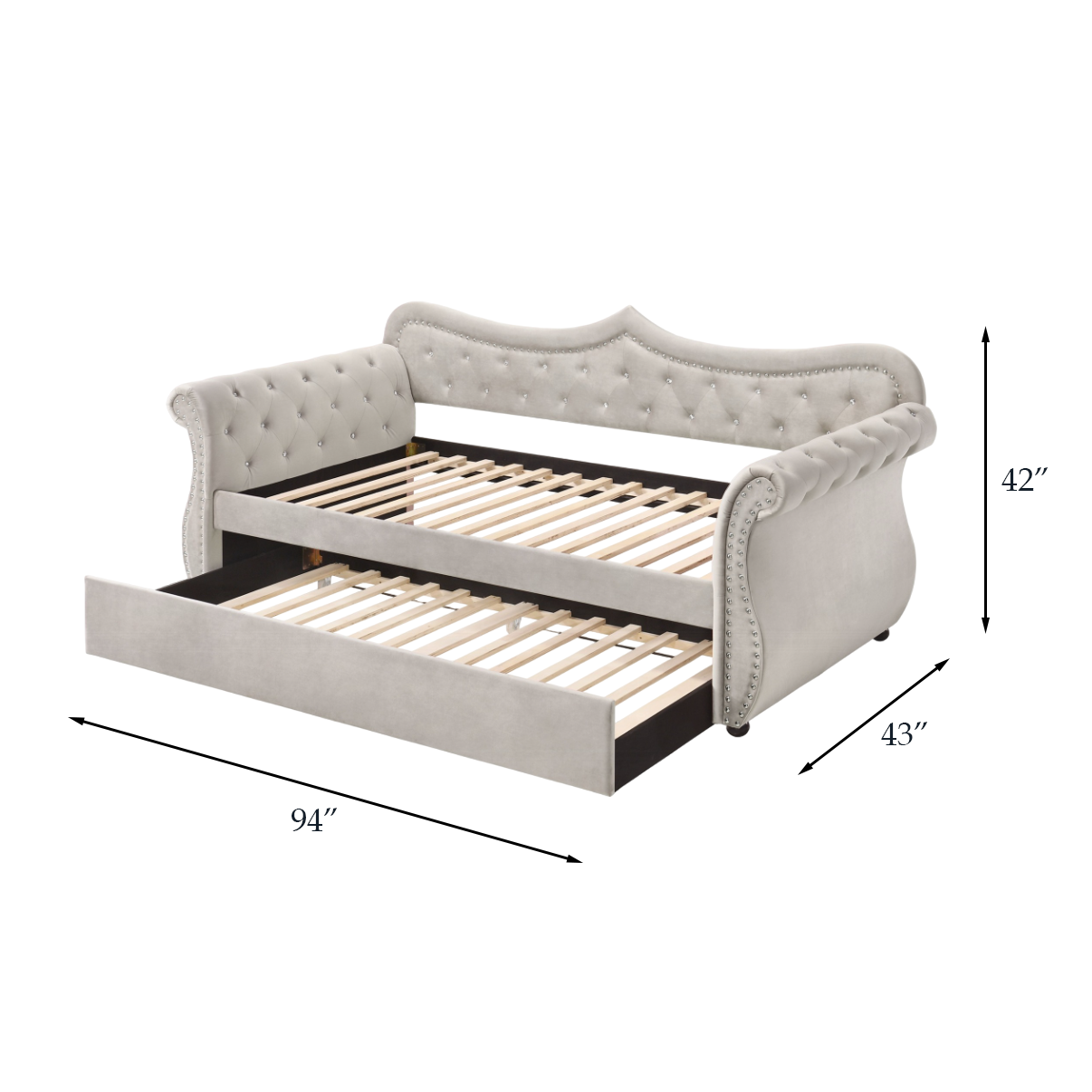 Elegant grey velvet daybed with tufted back and nailhead trim featuring a pullout trundle bed