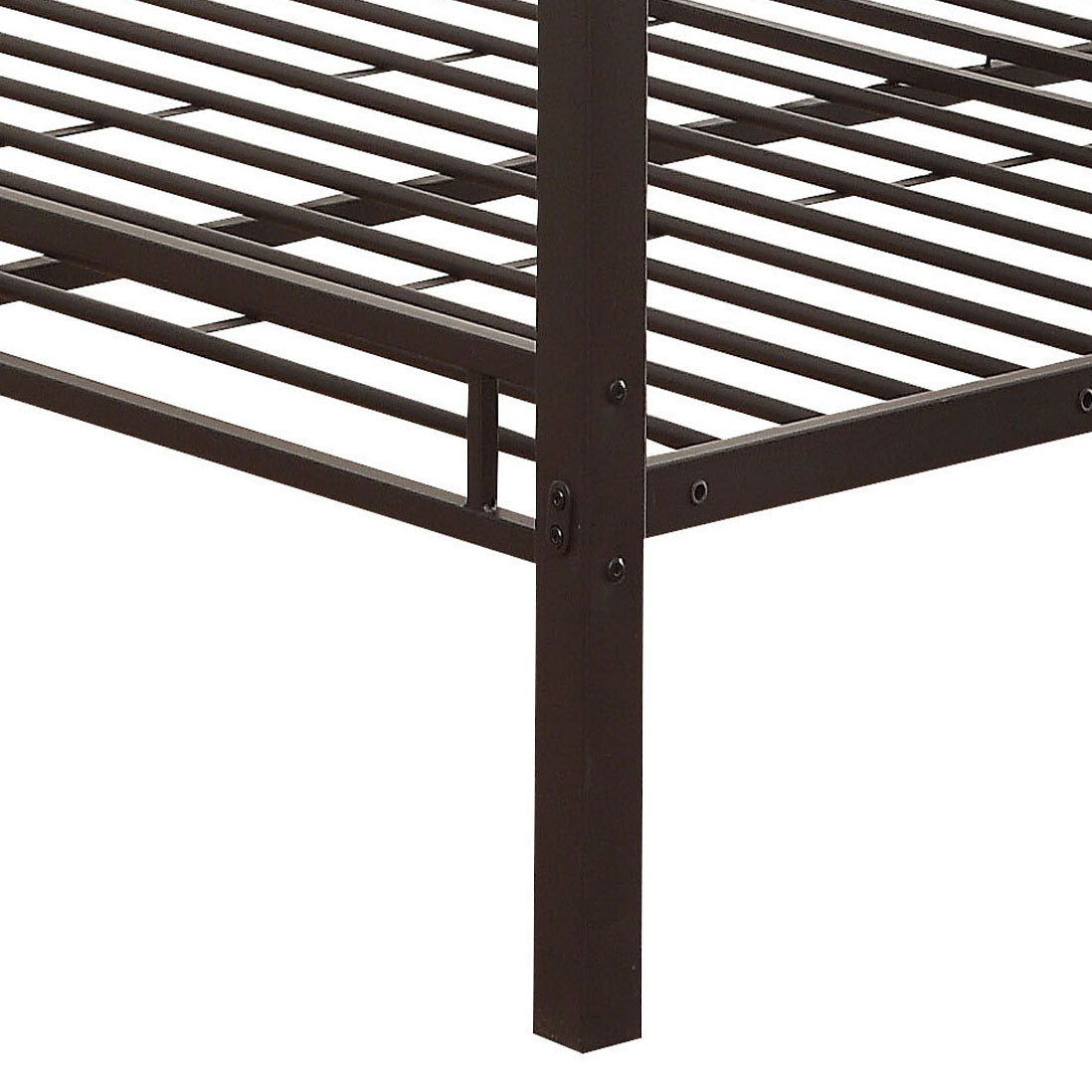 Closeup of dark brown metal bed frame legs and support slats