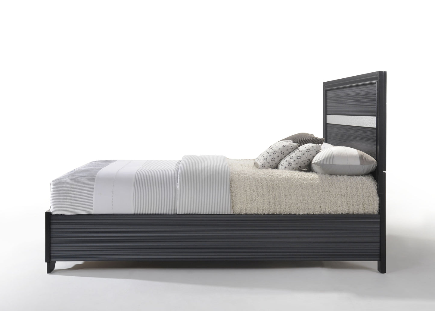 Modern grey upholstered bed frame with horizontal line detailing and plush bedding