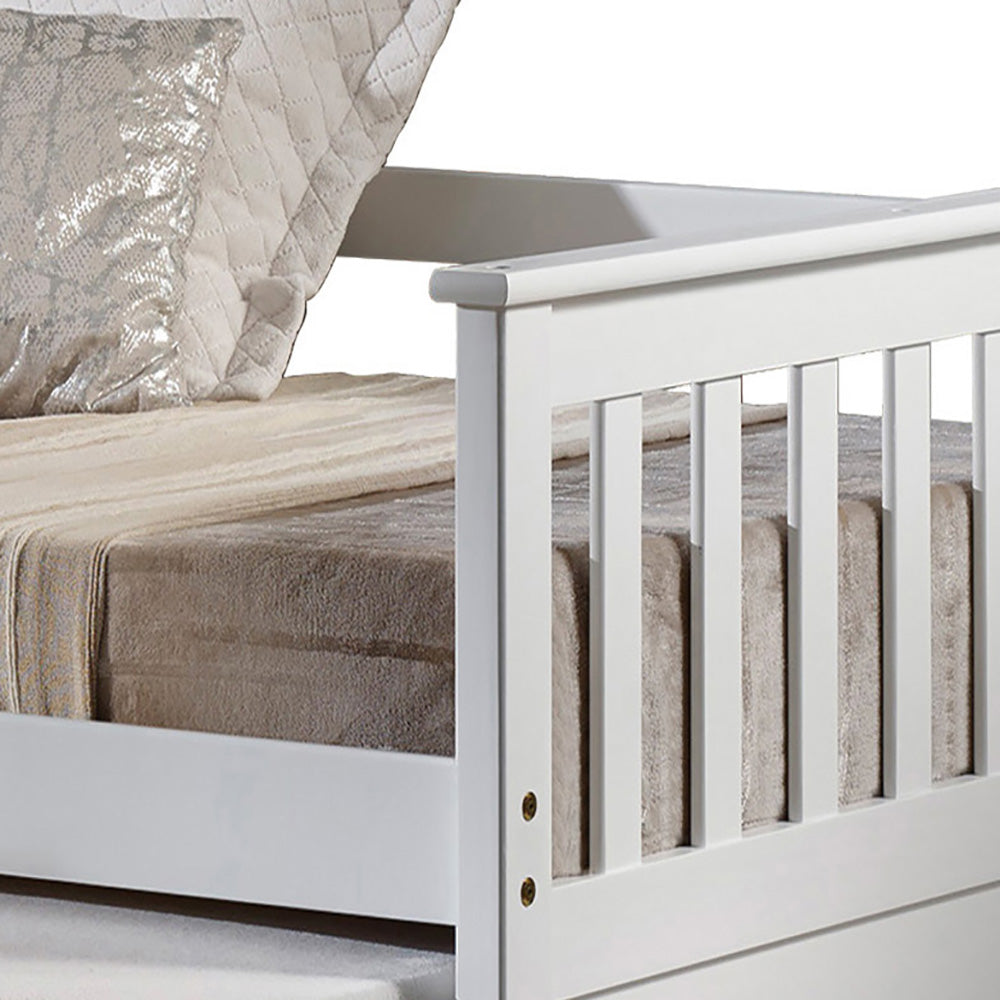 White wooden daybed with upholstered mattress and quilted decorative pillow