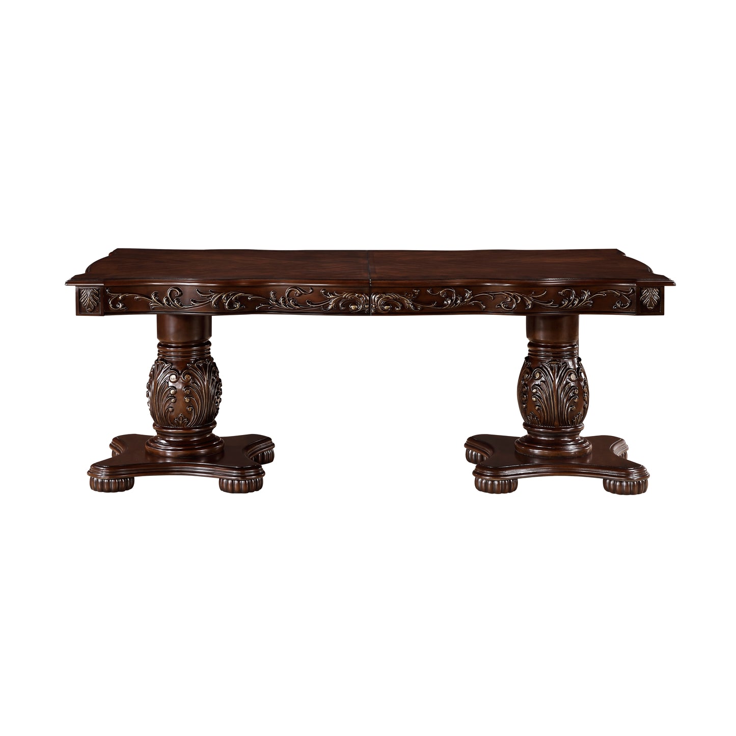 Ornate dark wood dining table with carved pedestals and detailed trim