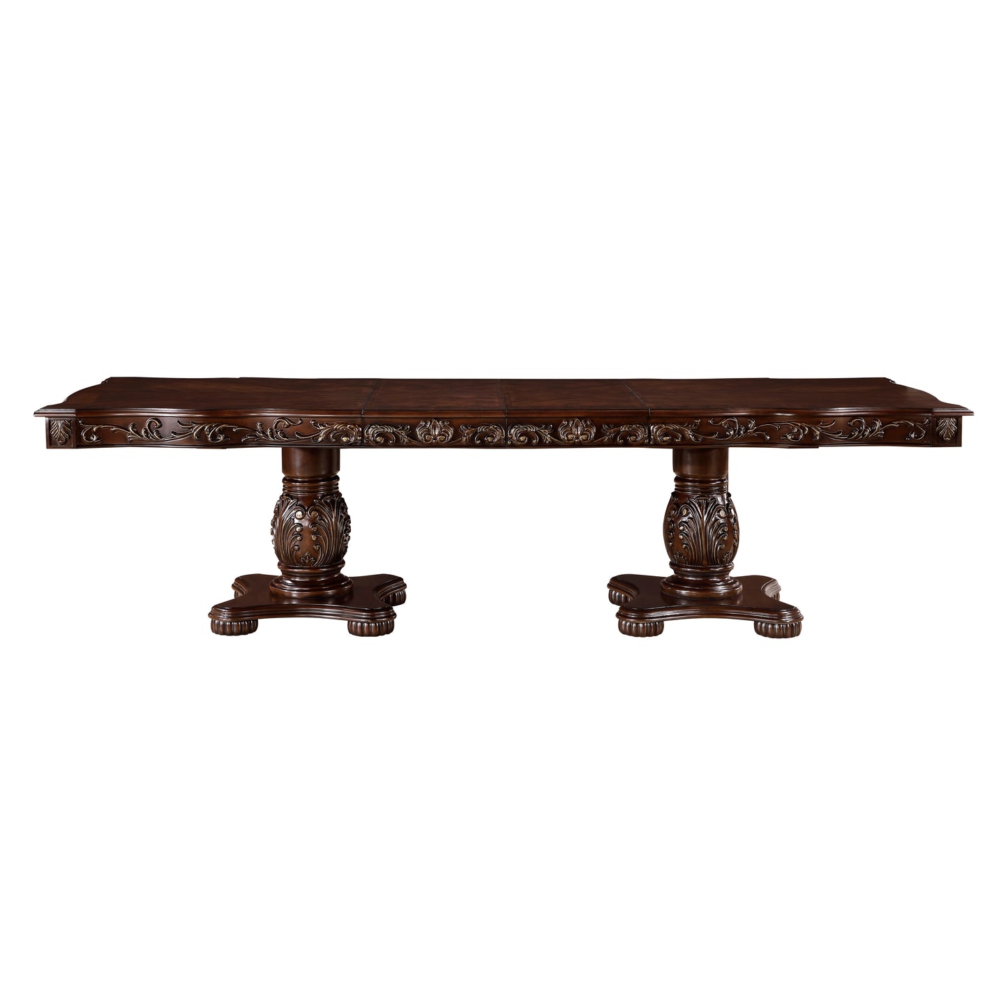 Ornate dark wood dining table with carved pedestal legs and detailed apron trim