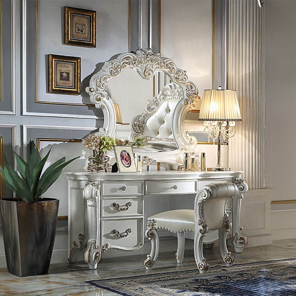 Ornate white vanity table with ornate mirror and matching upholstered stool an elegant bedroom furniture piece