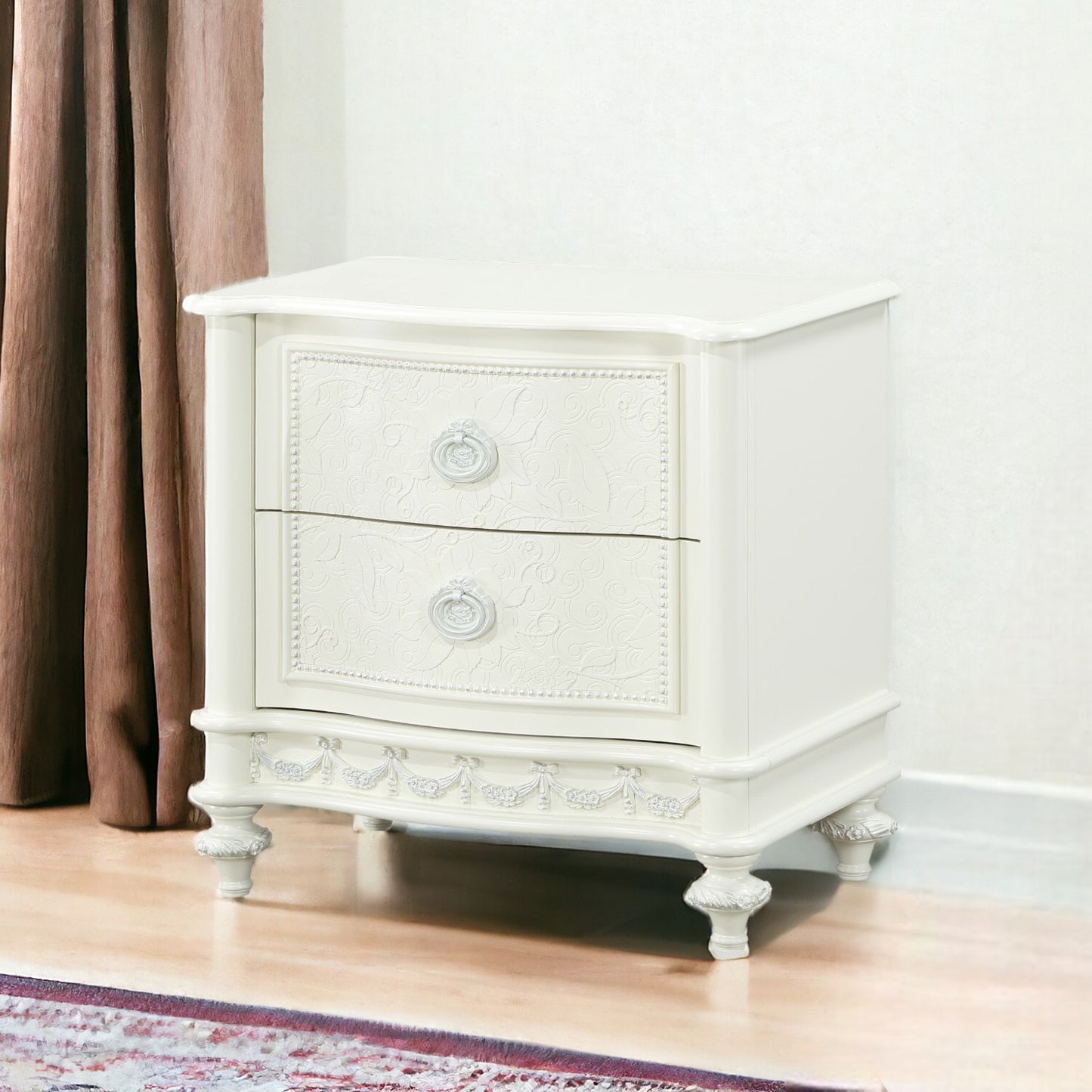 Ornate white twodrawer nightstand with carved details and ring pulls