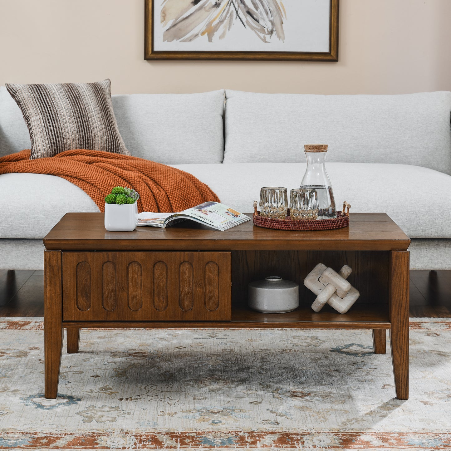 Midcentury modern walnut coffee table with fluted drawer detail and open shelving