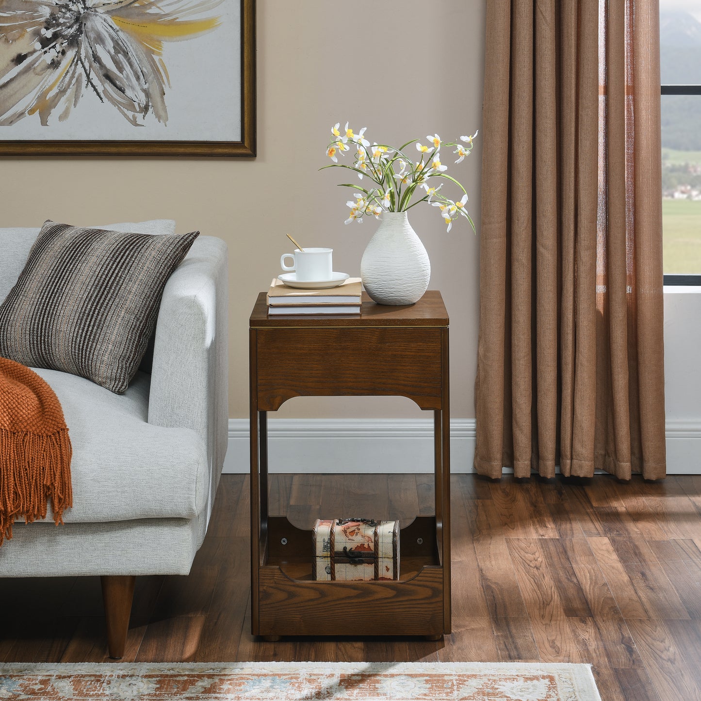 Dark oak side table with carved drawer front and decorative storage bin