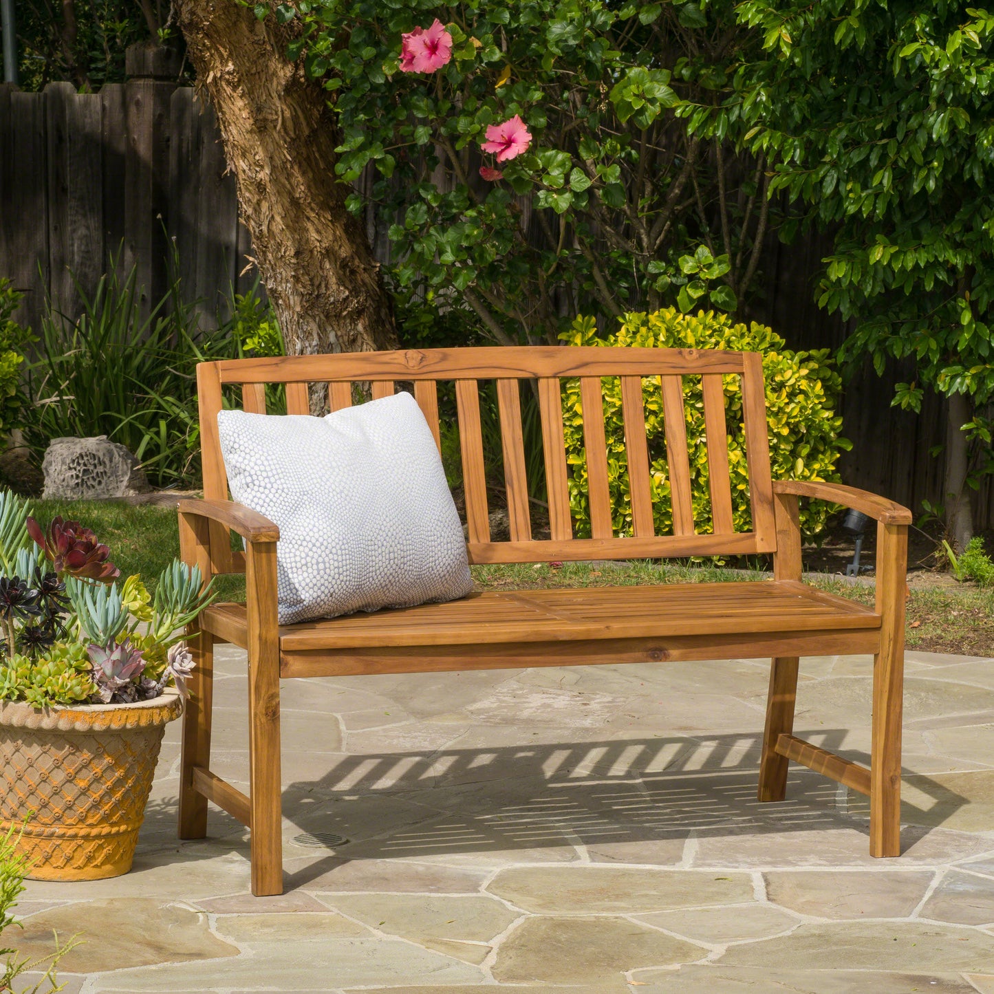 Wooden garden bench with slatted back and seat includes light grey cushion